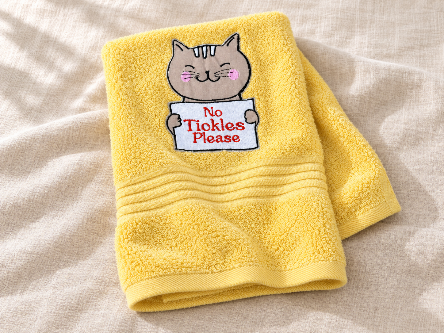 Yellow No Tickles Please embroidered towel